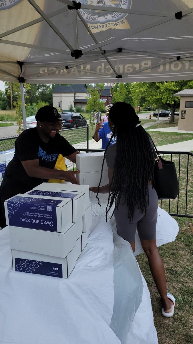 Jermaine packing supplies at a community service day.
